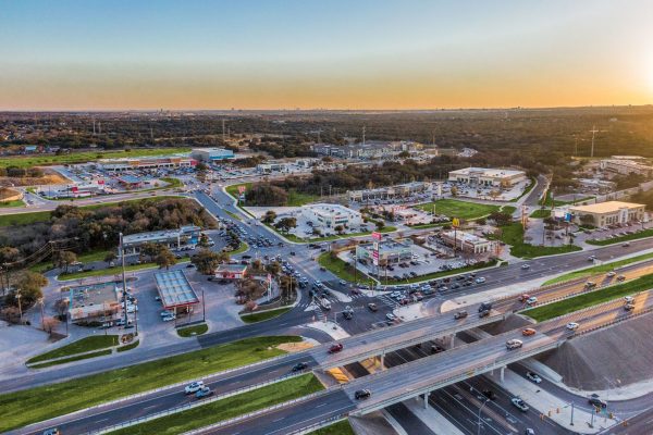 Aerial drone view of Bulverde, Texas highway intersection and commercial area near San Antonio